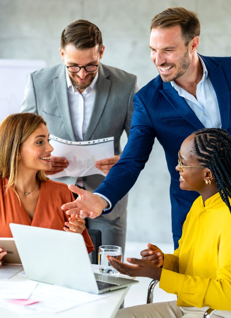 Happy, engaged employees working together toward a common goal