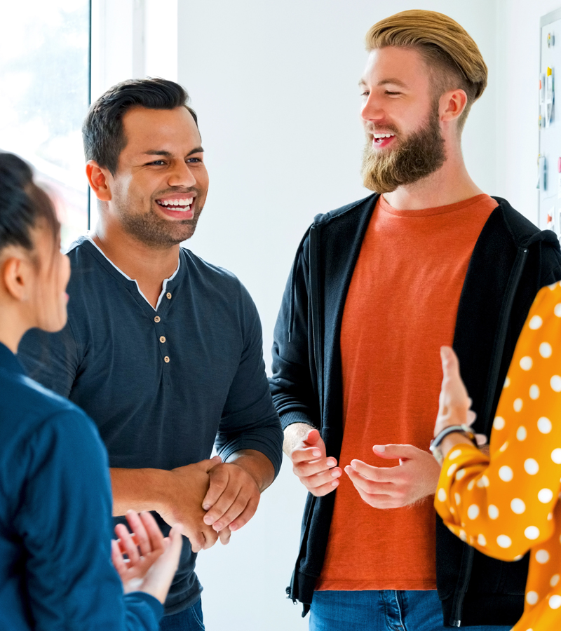 A cohesive team with two men and two women who collaborate effectively