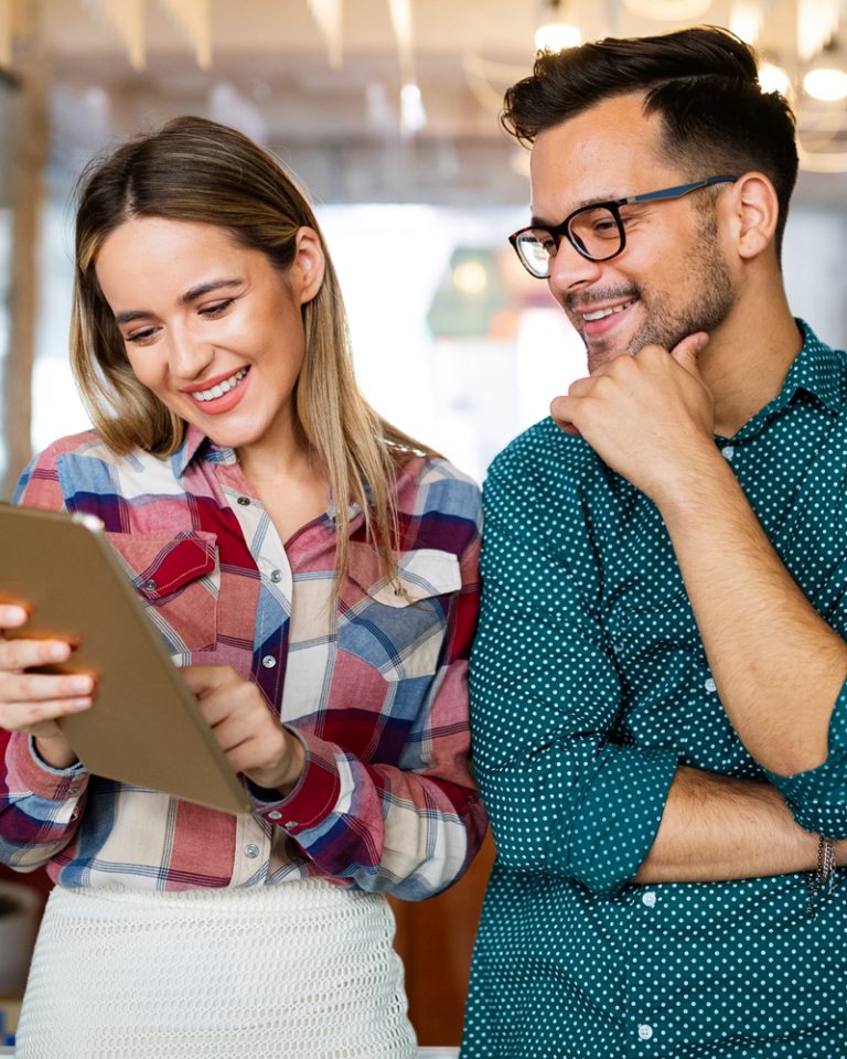 Two team members preparing for a team workshop and looking at MCode results
