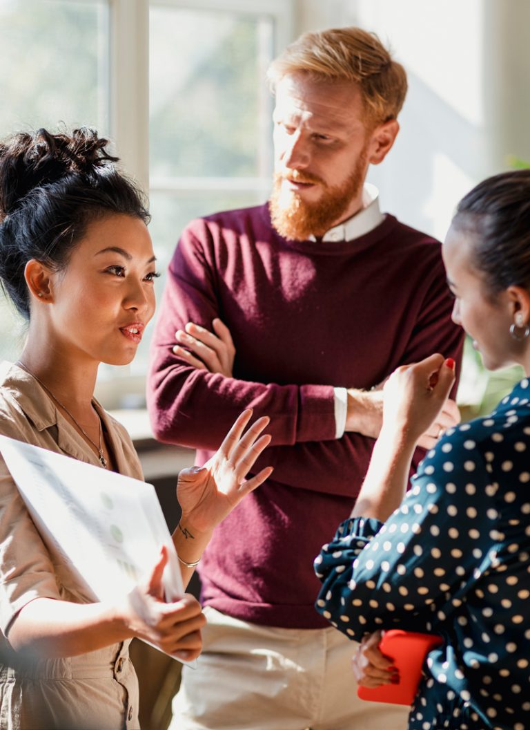 A confident, effective manager briefing her team on a new project