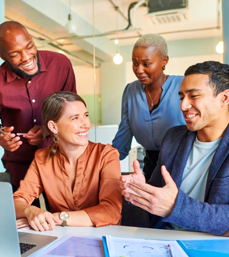 engaged-team-enjoying-work-img An engaged team of four diverse, motivated employees enjoying work