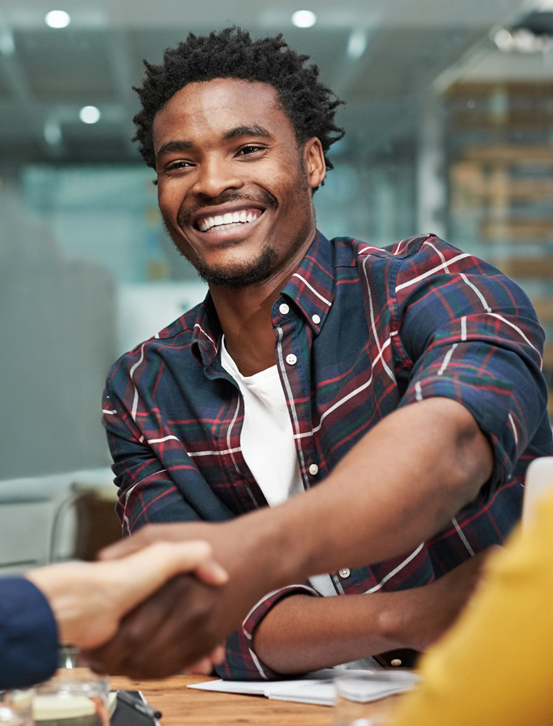 A young Black man gets his dream job after standing out in a job interview