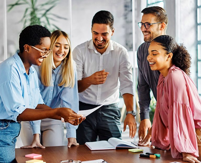 A diverse, motivated team engaged in a work project that has measurable business outcomes