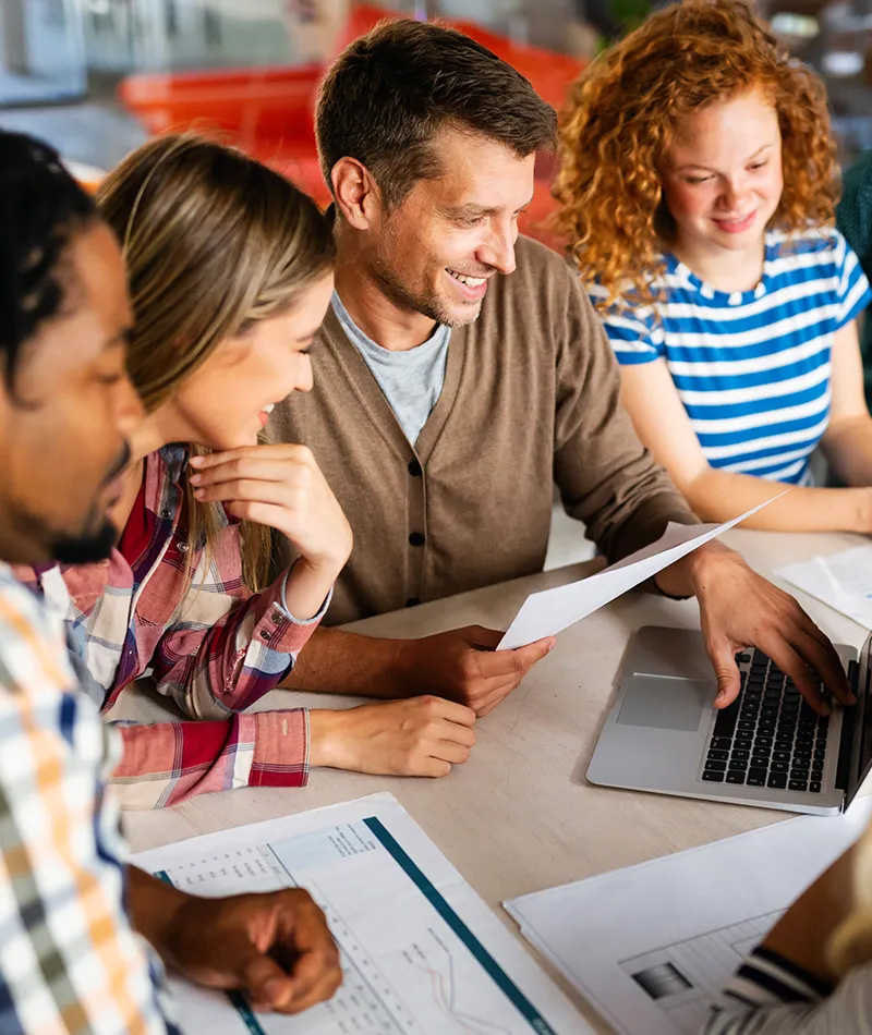 Team reviewing their MCode results and collaborating