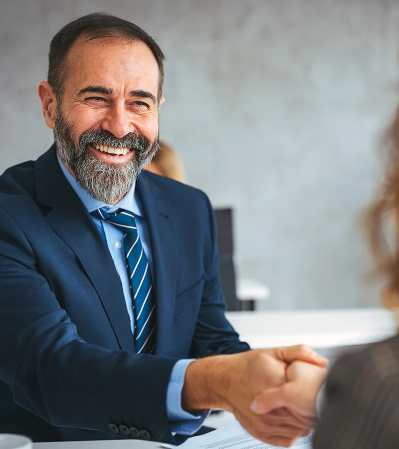 A business owner welcoming a candidate
