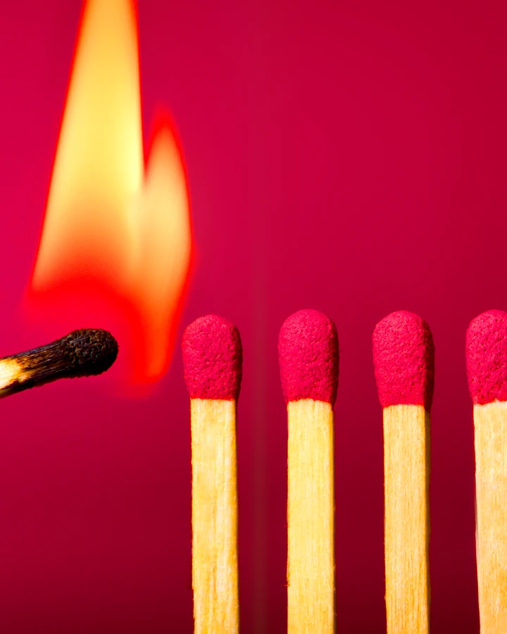 Image of matchsticks and a flame symbolizing the Influencers desire to create and spark change in people's lives.