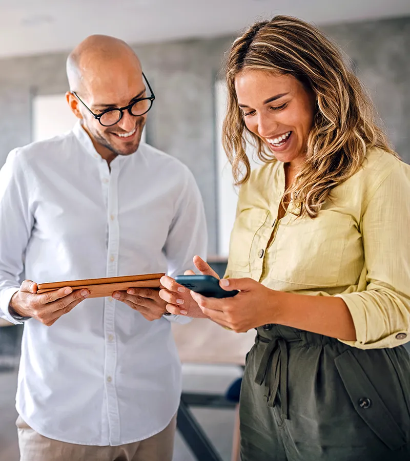 A man and a woman applying their MCode results while at work