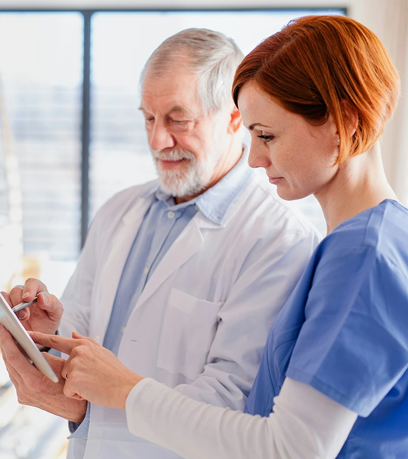 Medical associates reviewing a chart