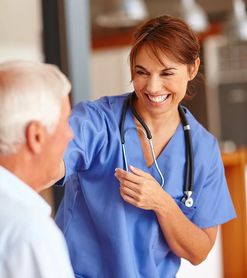 Nurse laughing with a patient