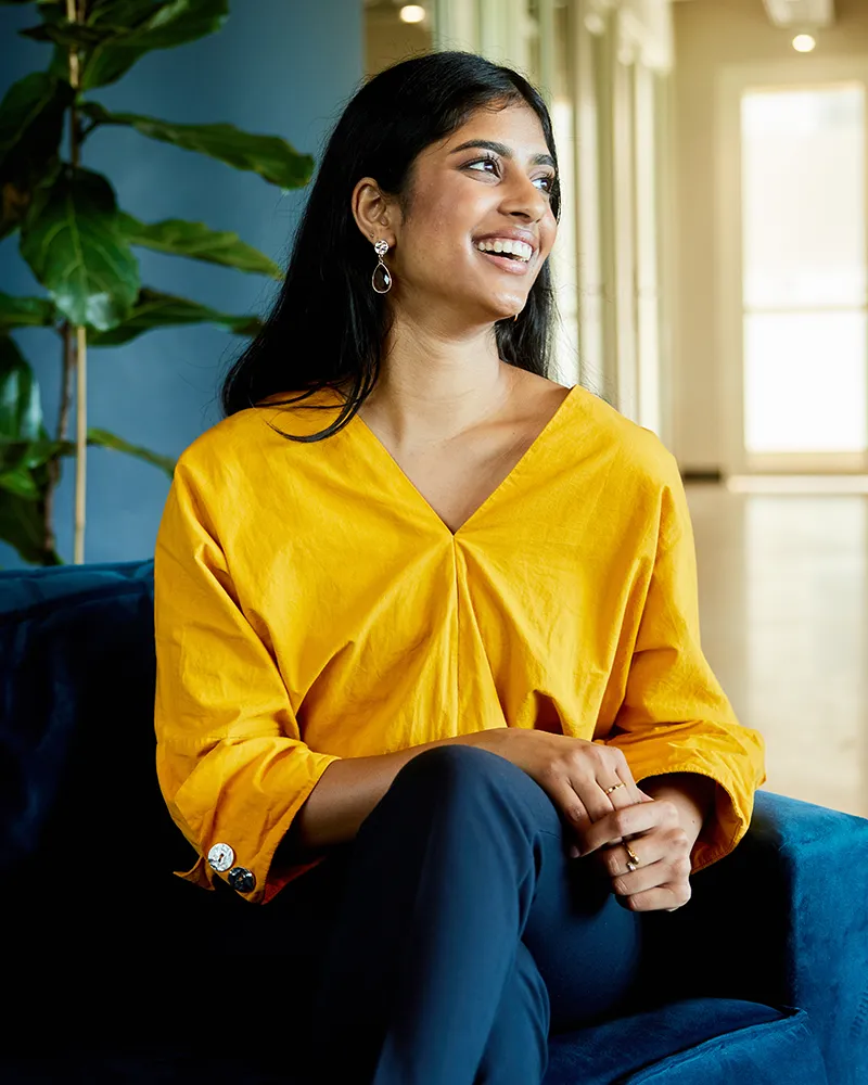A professional woman laughing in an office