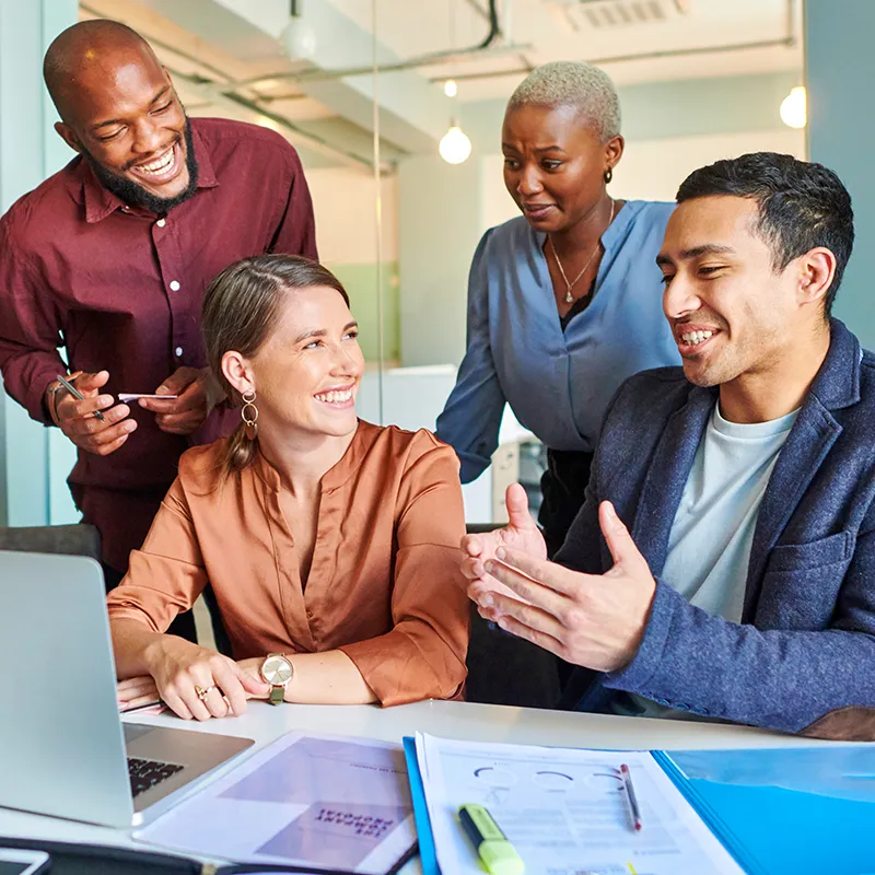 A team taking their MCode Assessment together and discussing their results.