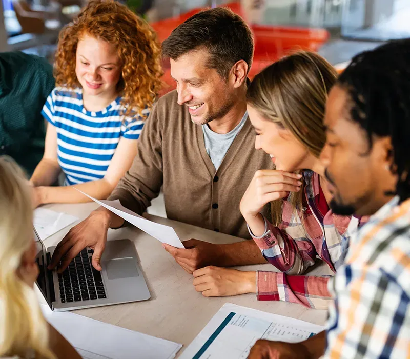 Team collaborating on a project at an agency